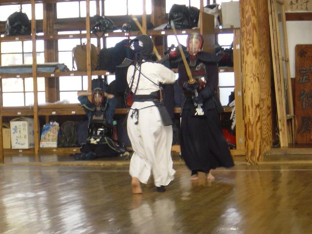 3 Japanese girls, 2 fighting with sticks